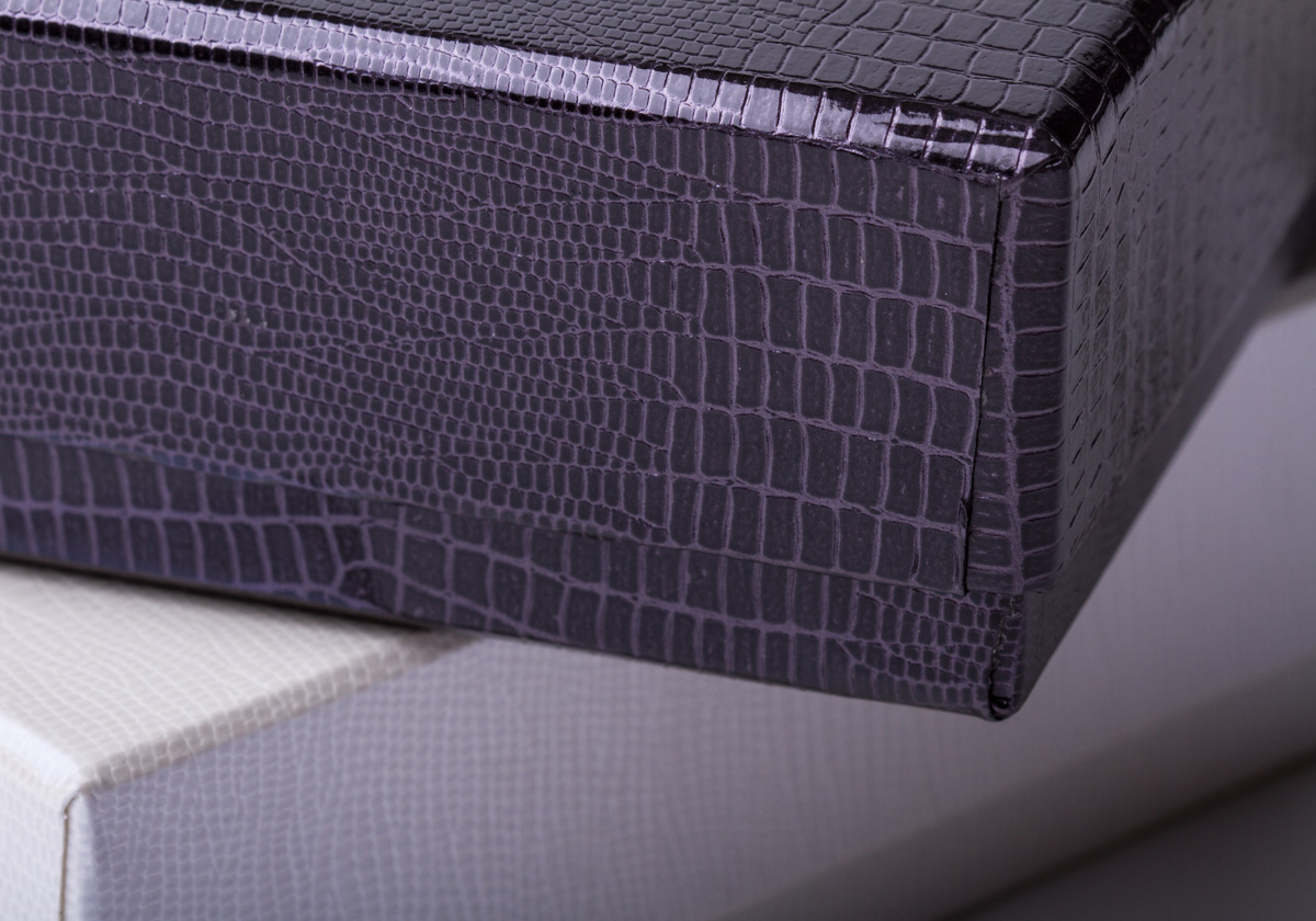 The iguana box option is available in black or pearl leatherette