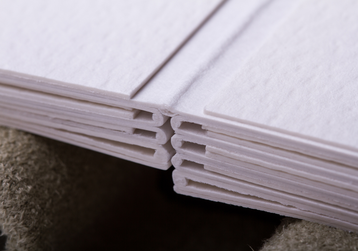 Pages are pre-bound and are precisely measured to account for a mat on each page